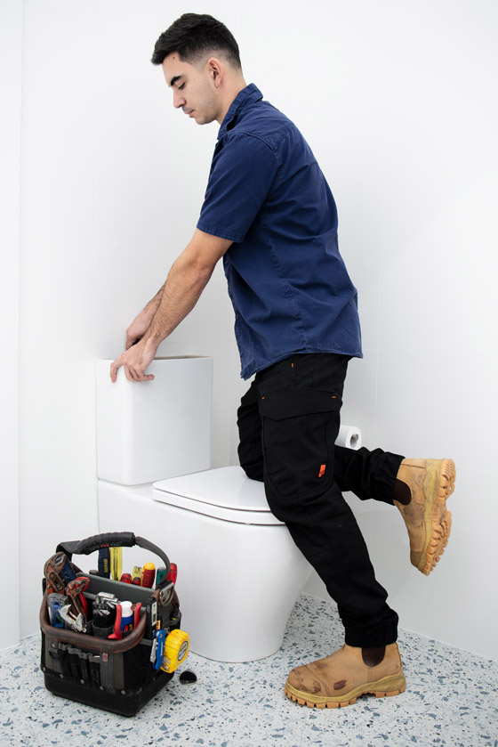 Plumber on the Central Coast fixing a blocked toilet quickly