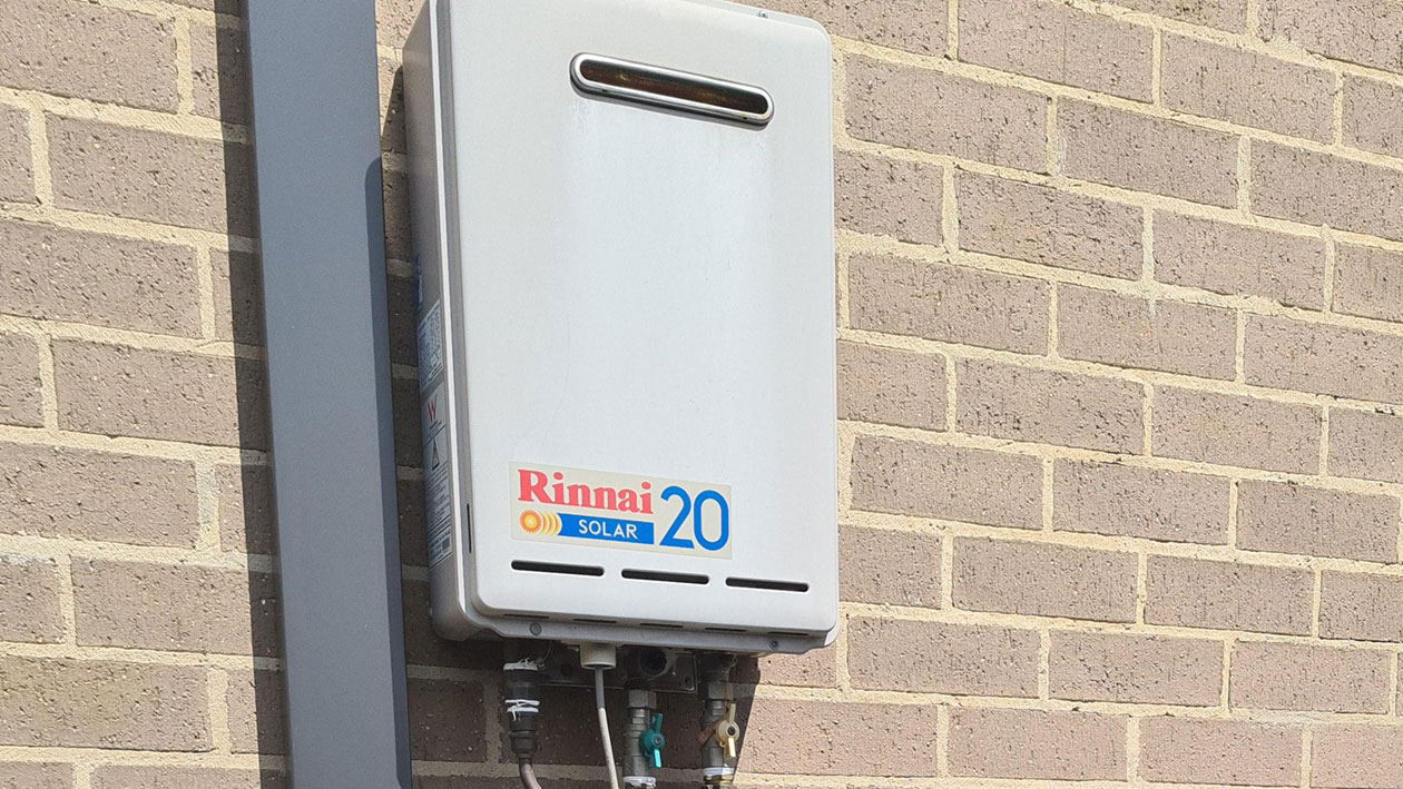 Rinnai Hot Water Heater on wall of house